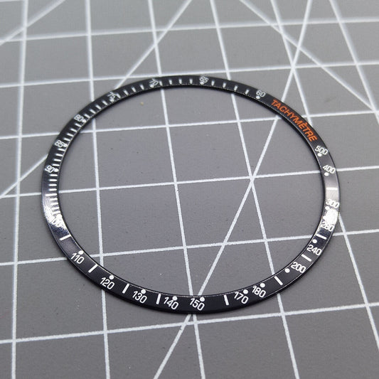 Black 38.5mm aluminum alloy bezel with white font for Omega Speedmaster watch, durable replacement accessory.