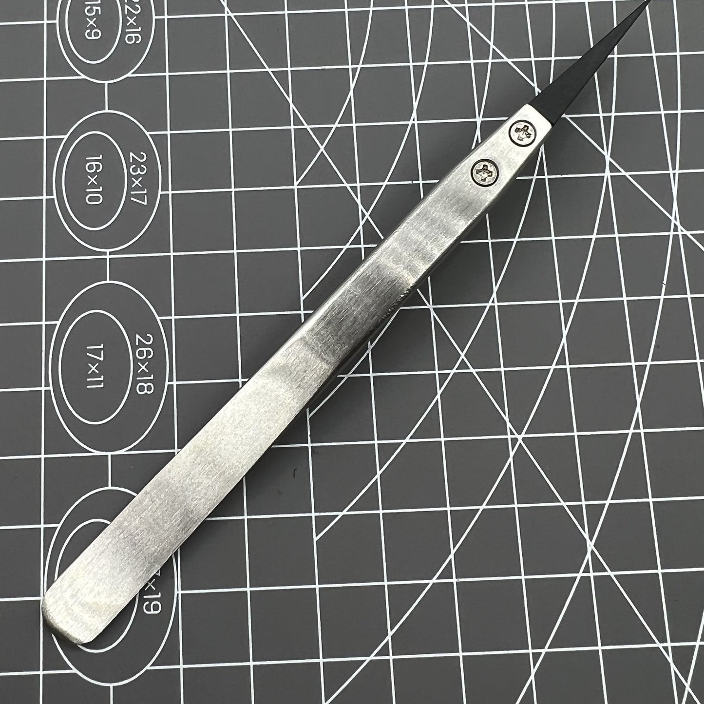 Stainless steel Carbon Fiber Head Tweezers for precise watch repair.