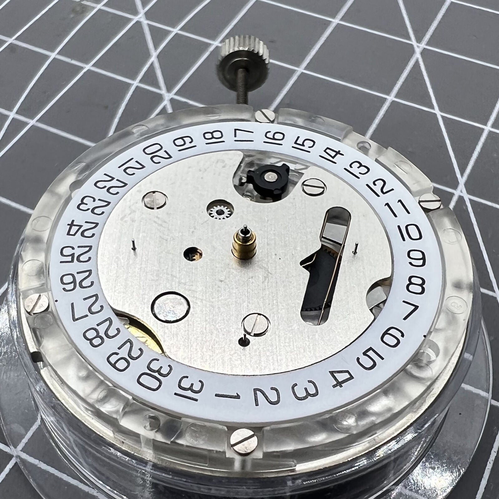 Tissot Genuine ETA C01.211 Swiss chronograph mechanical movement with white dial, precise watch accessory.