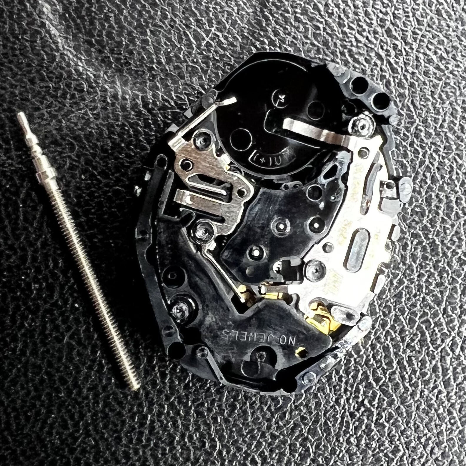 Hattori Epson PC21 quartz watch movement showcasing precise internal gears for accurate timekeeping.