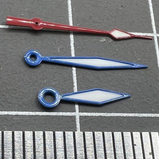 Diamond-shaped blue luminous watch hands with red trim, compatible with Ronda 515 quartz movement, brand name included.