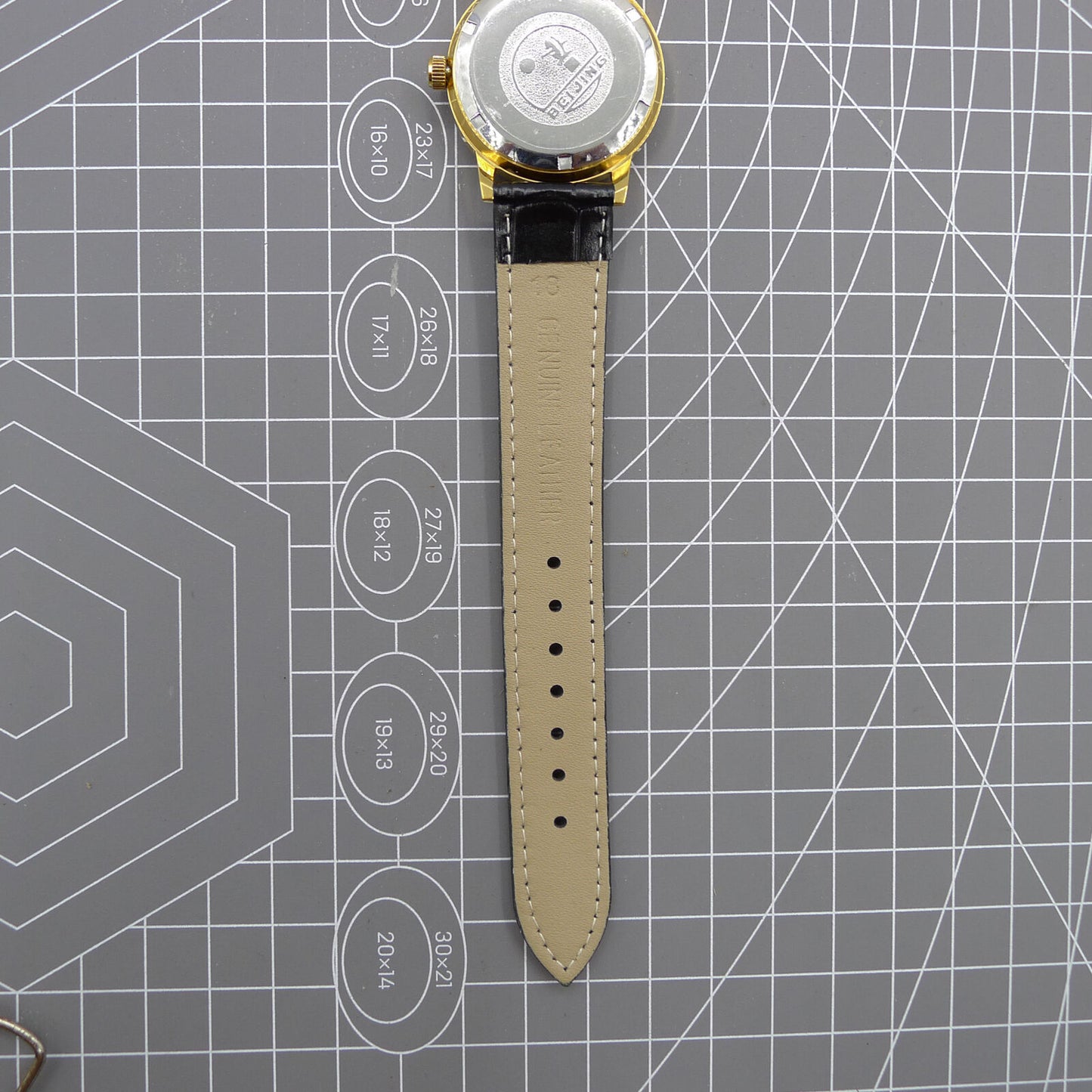 Beijing Double Rhomb watch with golden case, silver nail markers, manual movement for timeless elegance.