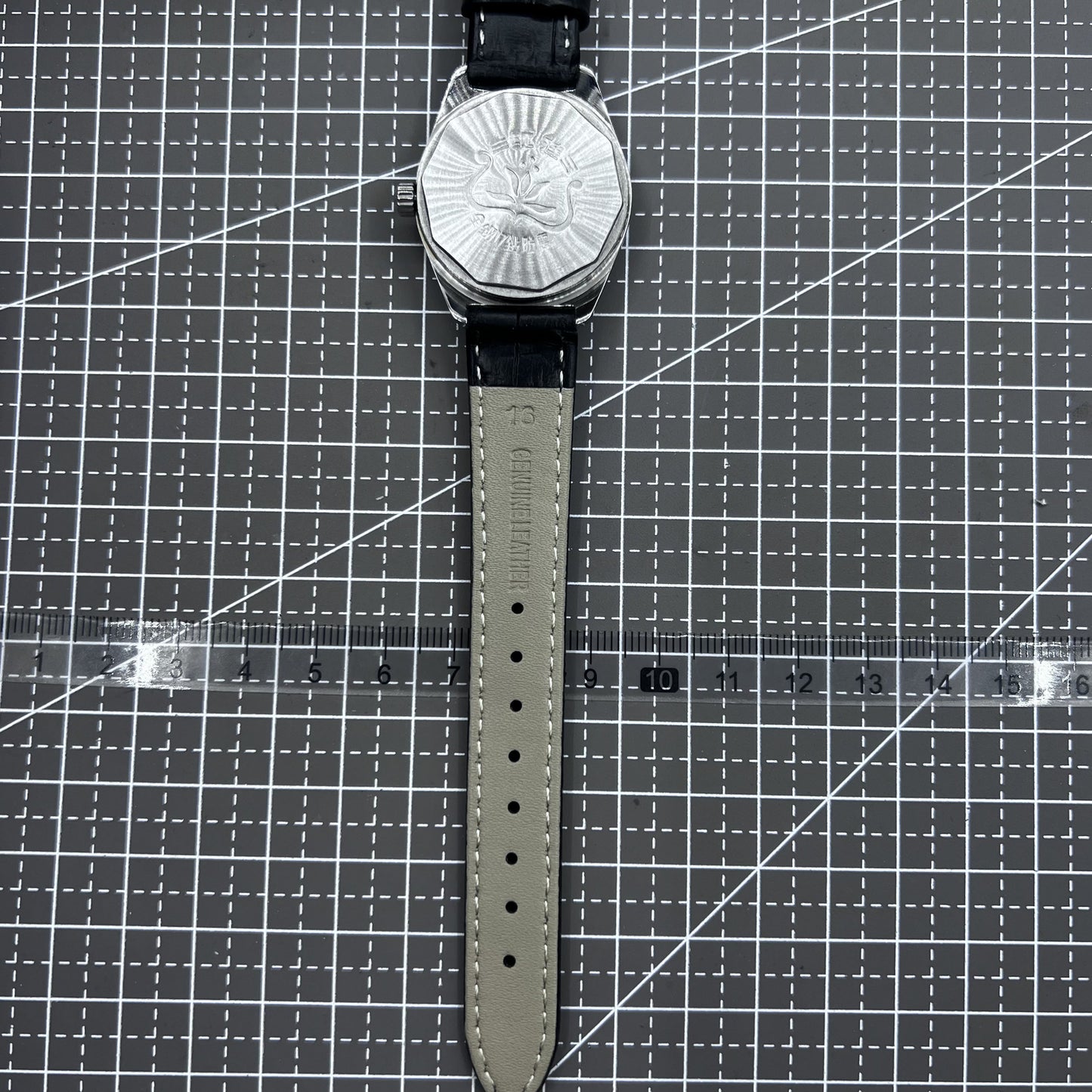 Taihang 32mm manual mechanical watch with black strap, gold markers, and black dial for classic elegance.