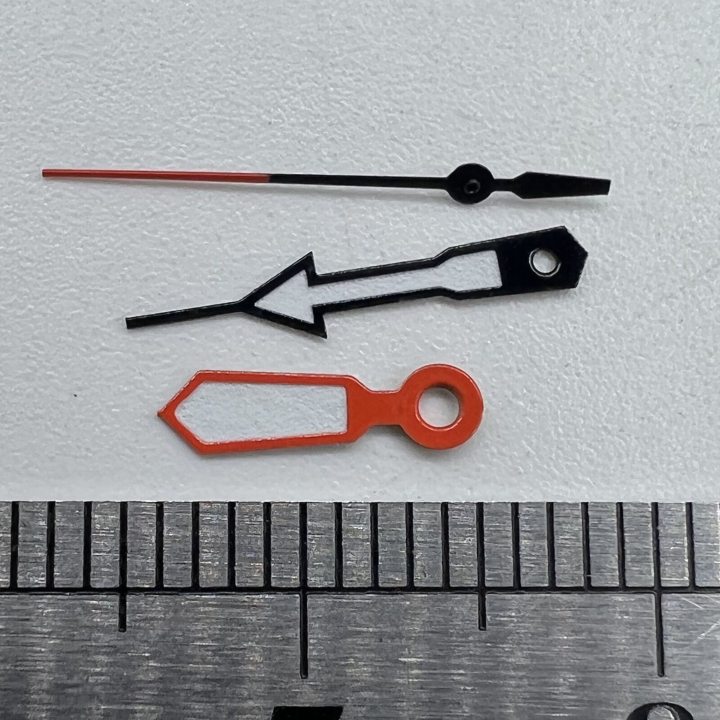 Orange and blue trimmed watch hands with white paint for Miyota 2315 and compatible models.