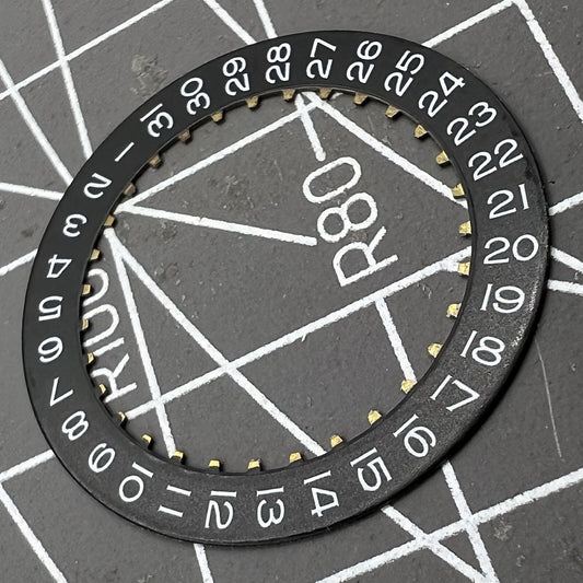 Black date wheel disk for ETA2824 watch movement with date display at 3 o'clock position.