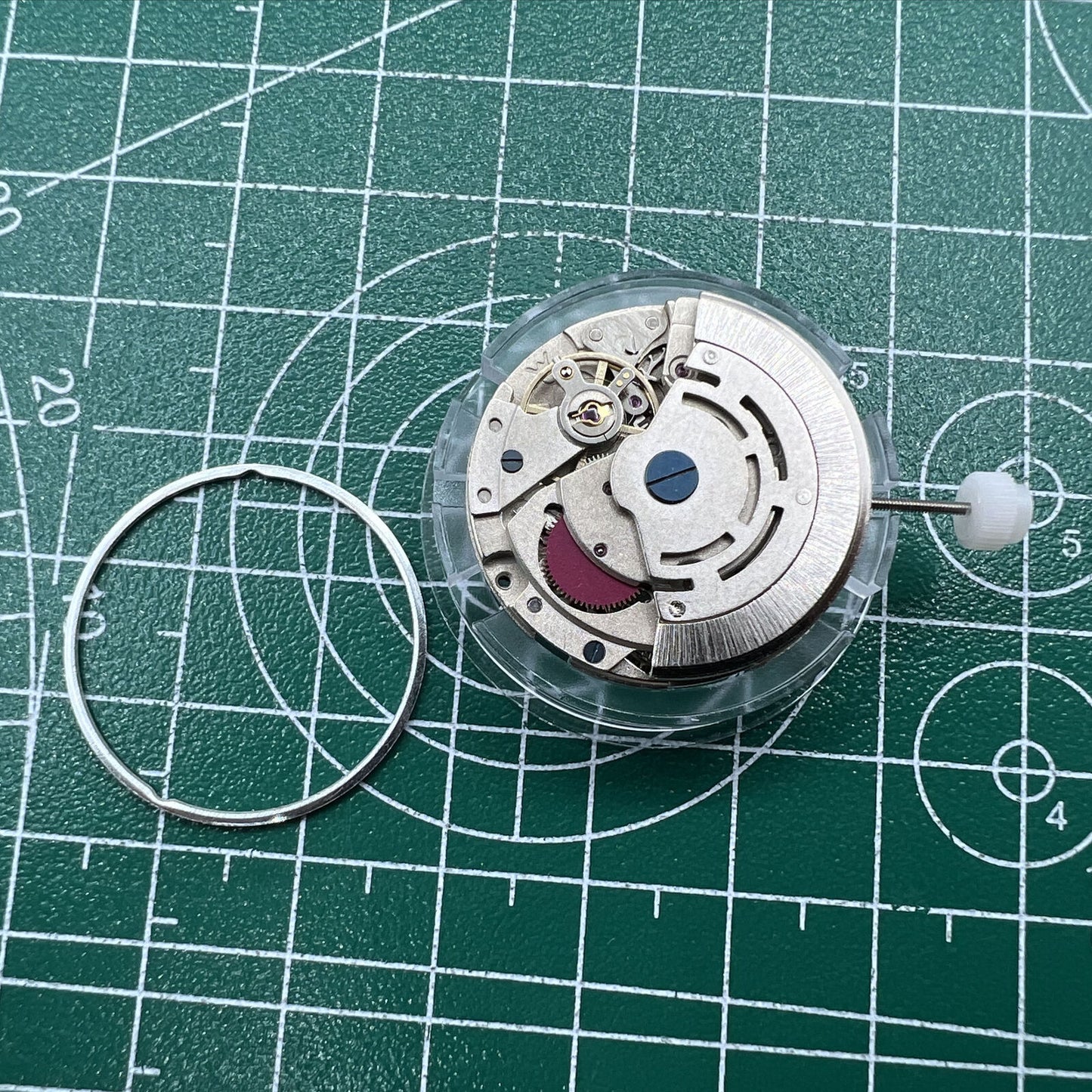 Mingzhu DG2813 silver automatic watch movement with 3 hands, ideal for watch accessory replacement.