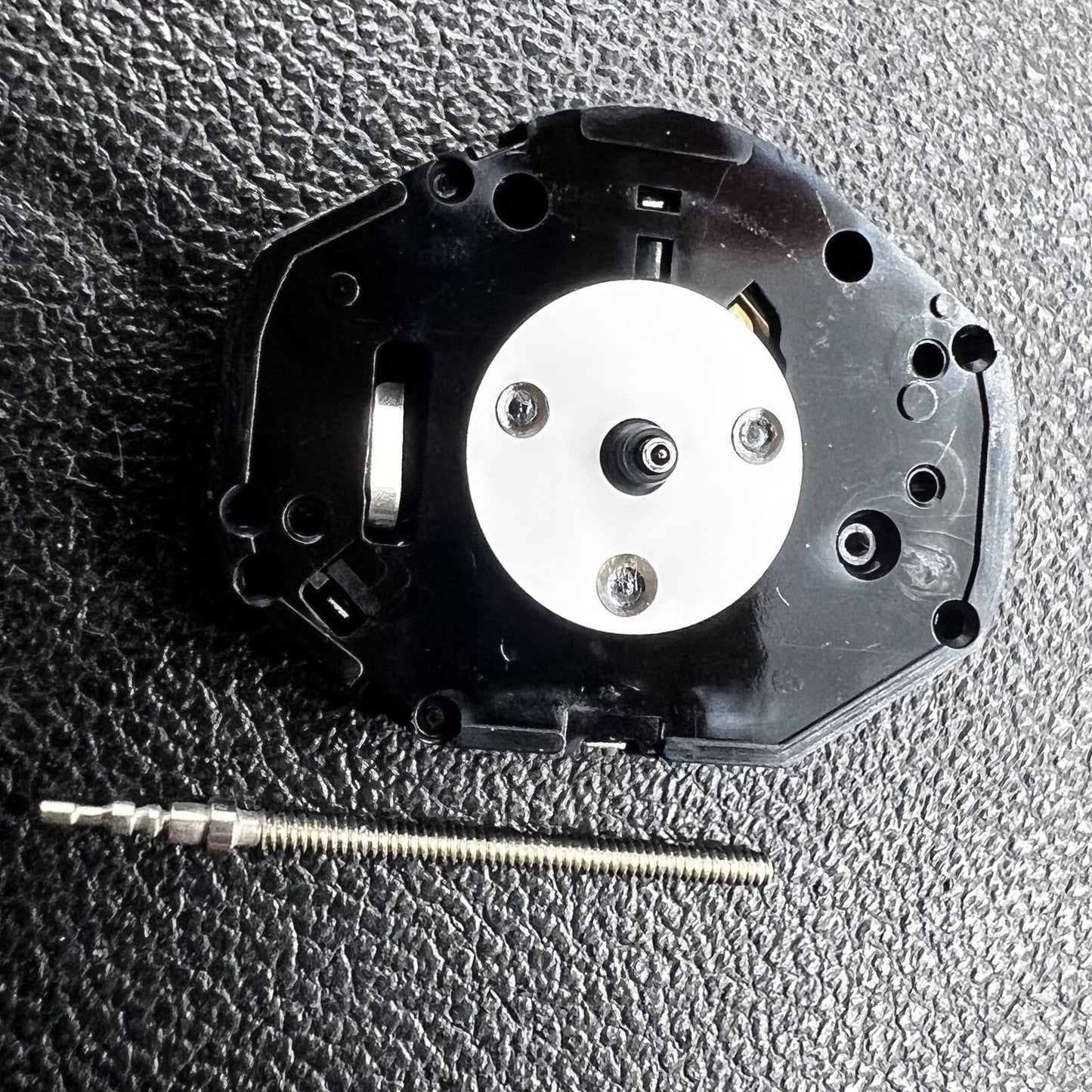 Hattori Epson PC21 quartz watch movement showing precise internal mechanism for timekeeping.