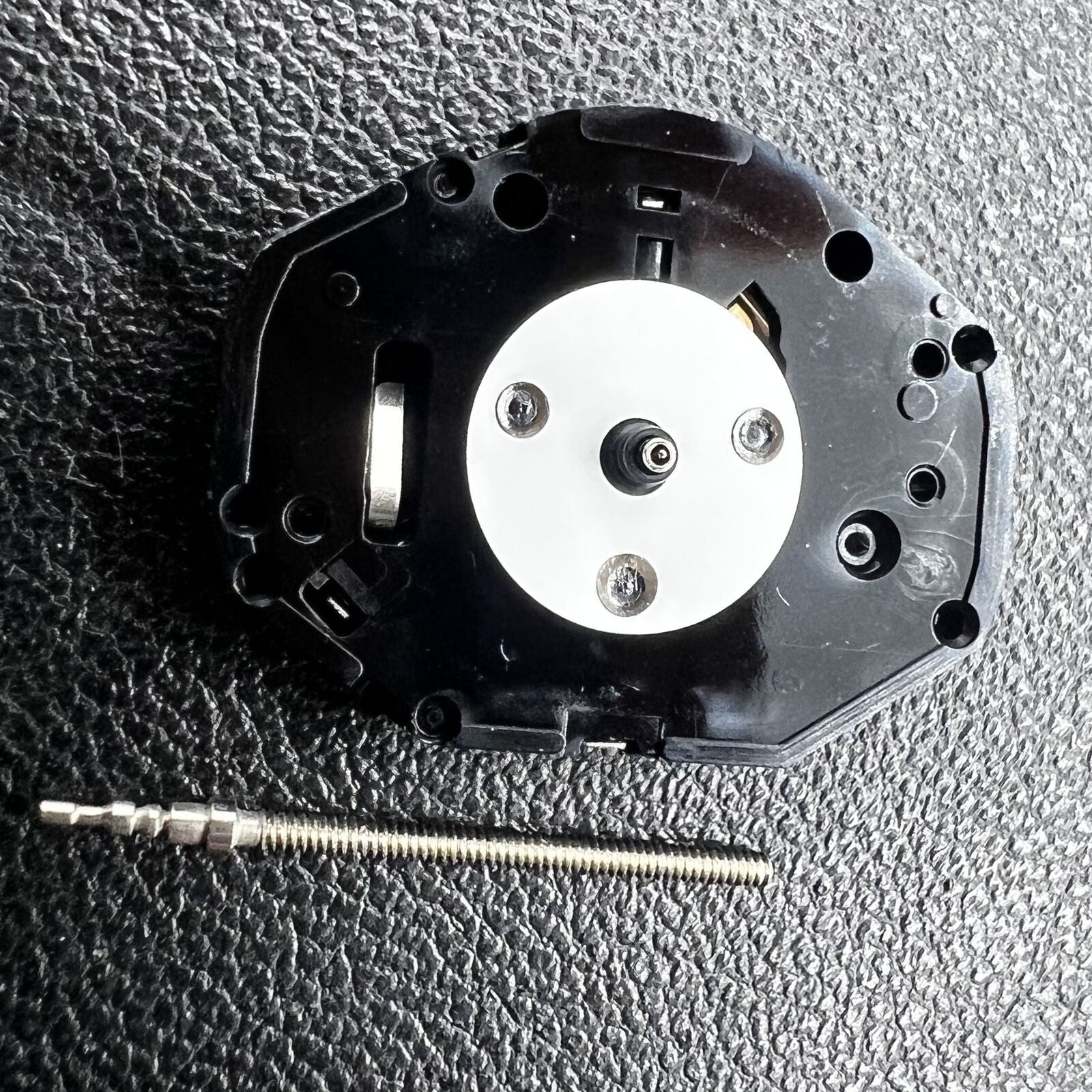 Hattori Epson PC21 quartz watch movement showing precise internal mechanism for timekeeping.