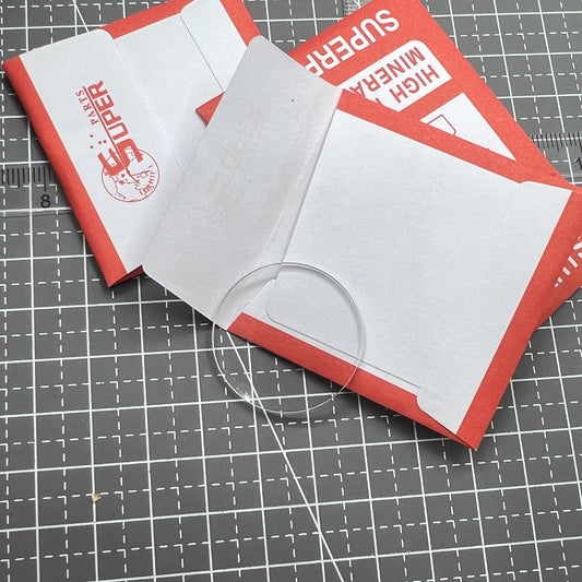 Set of 32 flat round mineral crystal watch glass covers, 24.1-36.8mm, 2.0mm thick for precise repairs.