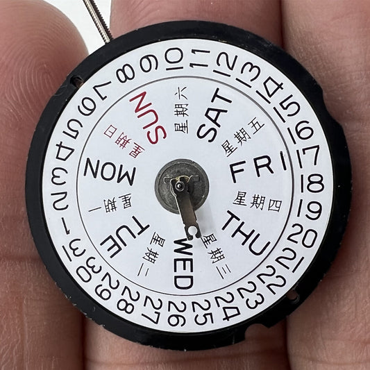 Ronda 517 quartz watch movement with English & Chinese day-date display at 3 o?clock, Swiss precision parts.