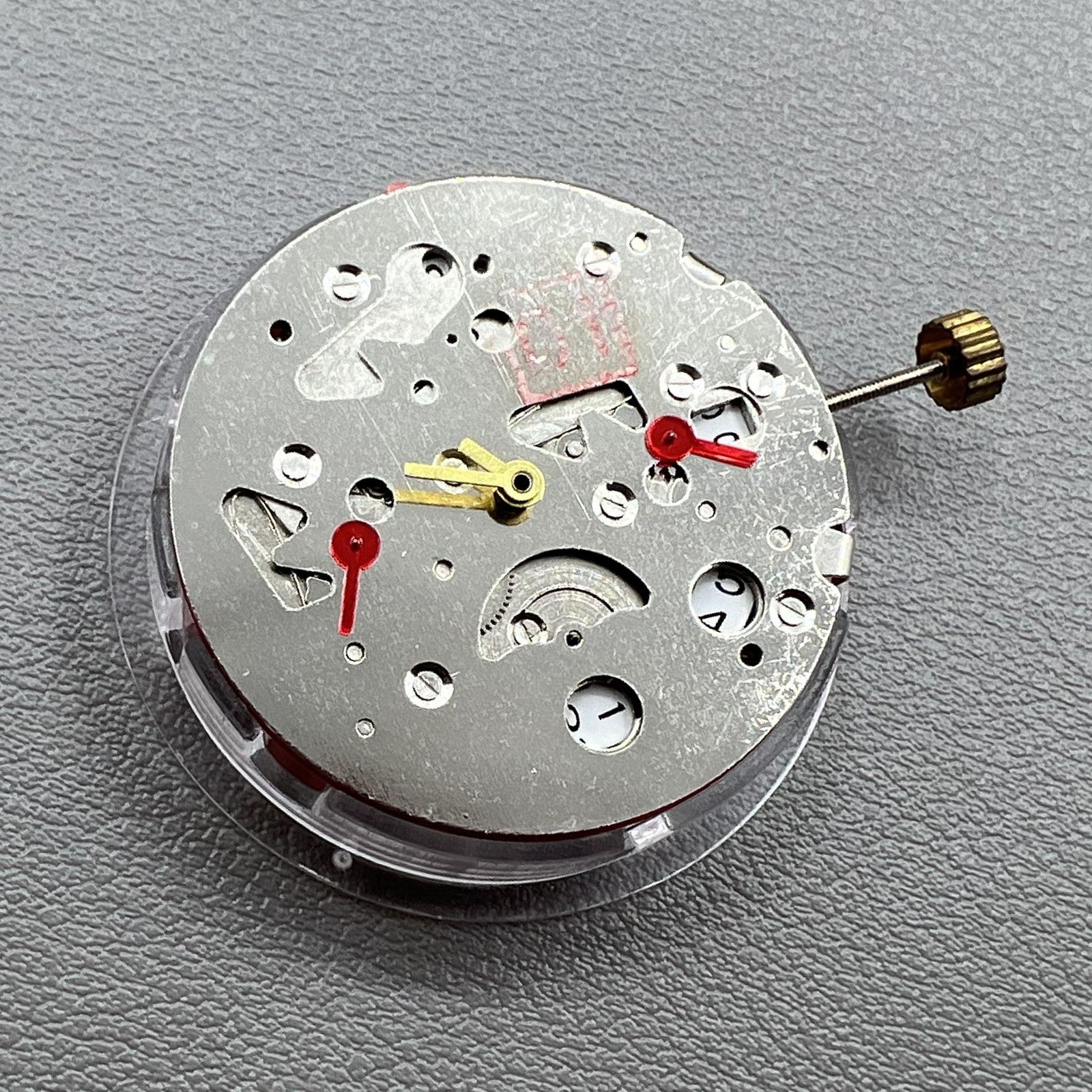 China Made 7120 mechanical watch with second hands at 3/6/9, date display, sleek design by China Made.