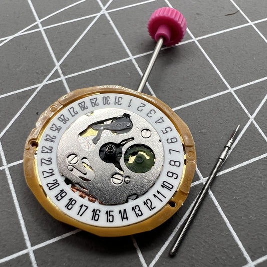 Miyota 9T13 Quartz Movement with date at 6 o'clock, precision Japanese watch component.