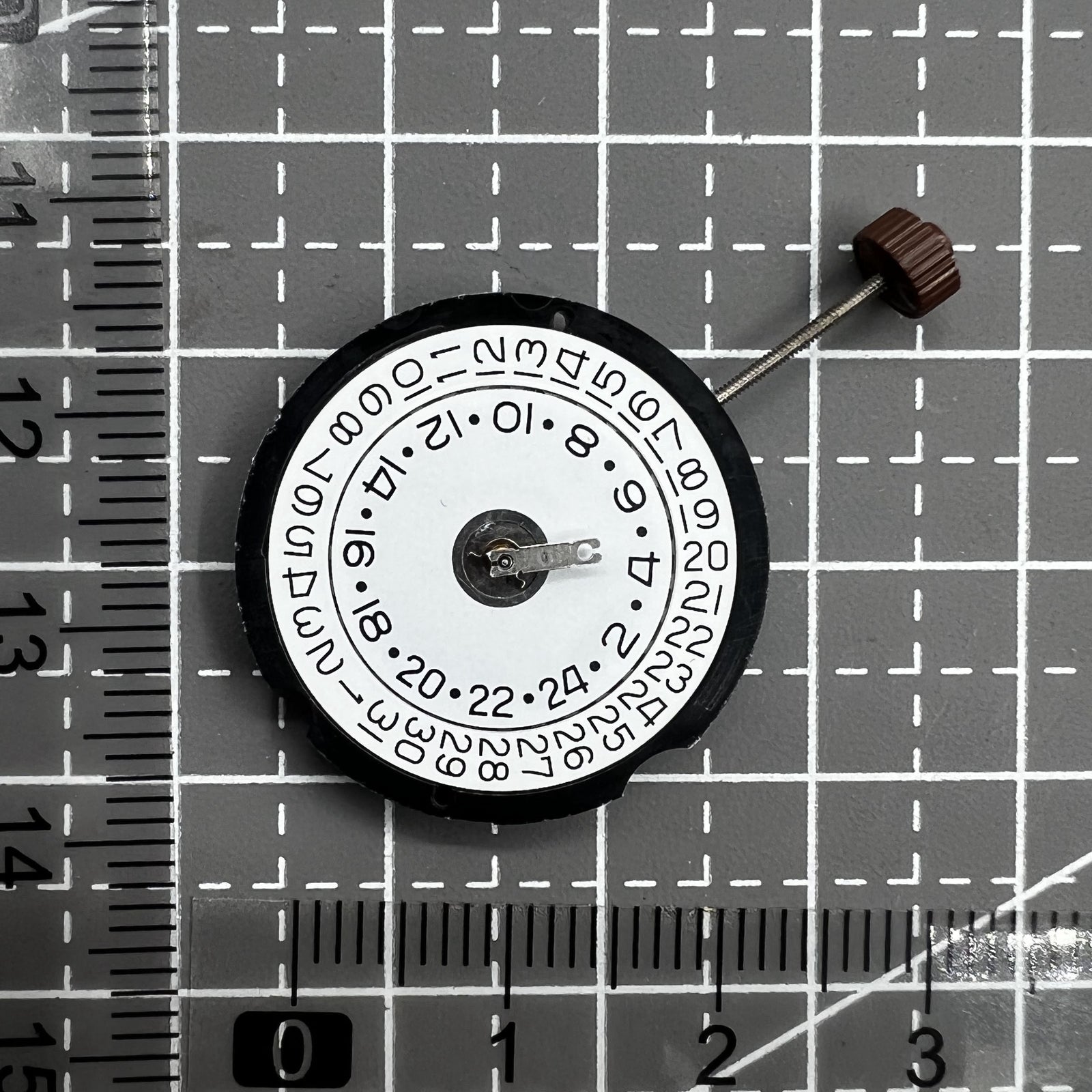 Ronda 505 24D quartz watch movement with date display at 3 o'clock, precise timekeeping mechanism.