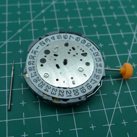 Wholesale Miyota JP11 watch movement with date at 3 o'clock, reliable Japanese quartz mechanism.