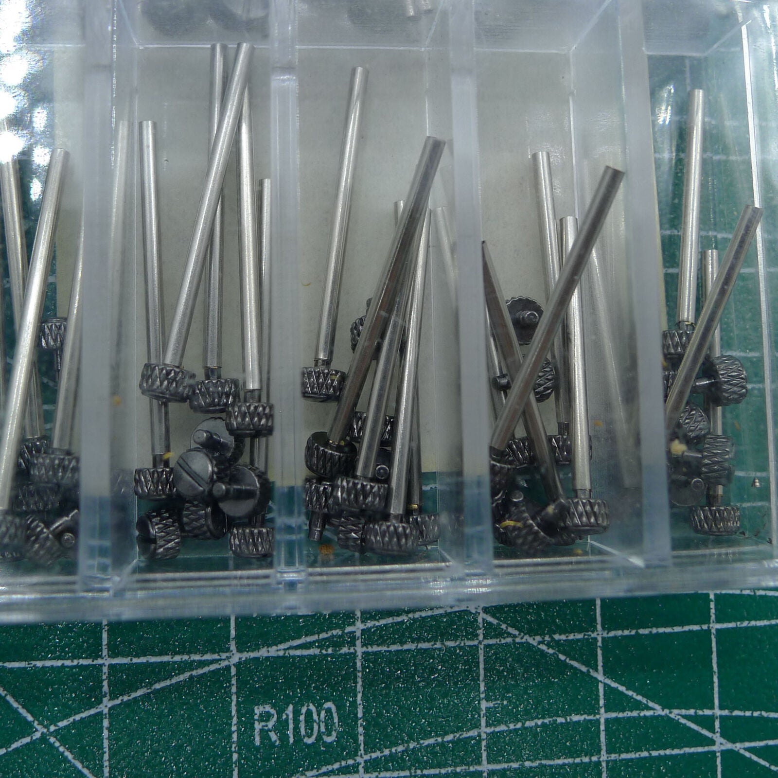 Stainless steel spring bar T-bars with studs screws for watch strap repair, linen finish.