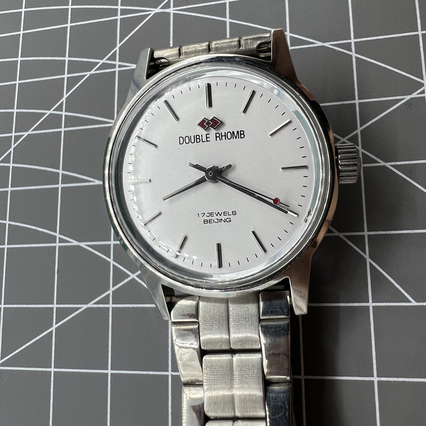 Beijing 31mm manual mechanical watch with silver case, three hands, classic China-made elegance.