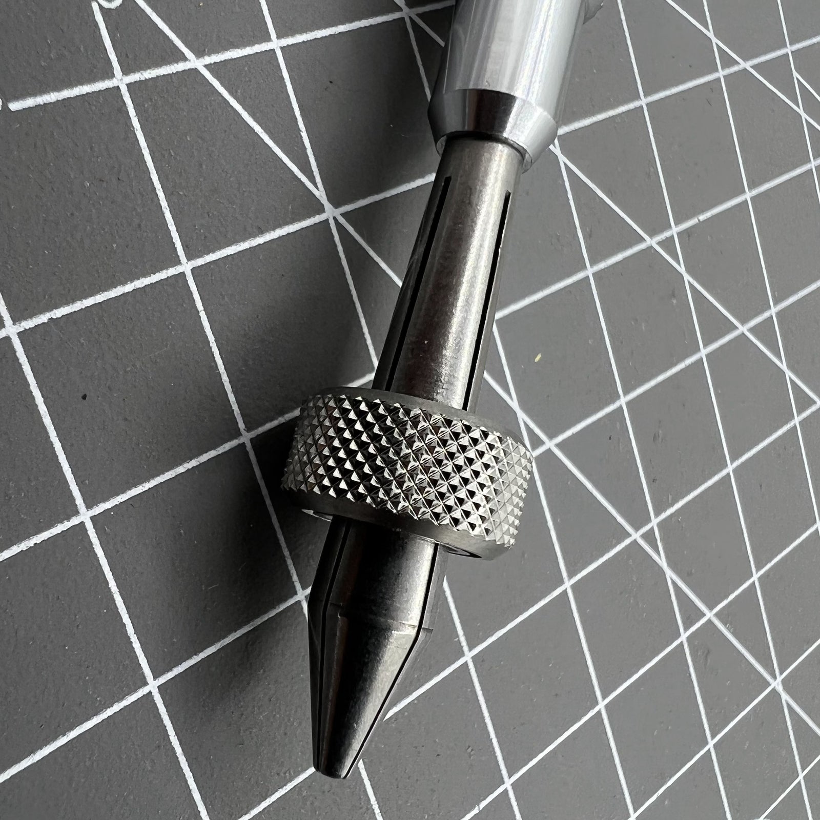 Holder clamp tool pin vice for precise watch crown lever repair and adjustment.