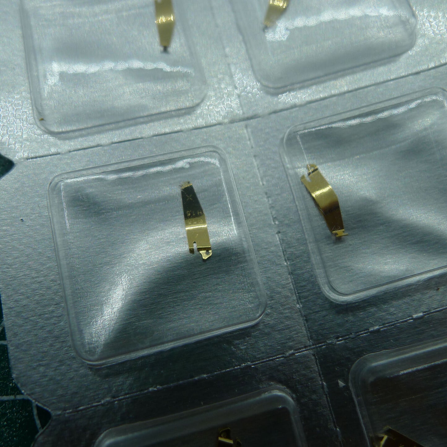 Wholesale ETA976.001 battery fixing plate for quartz watch movements, ideal for precision repair tasks.