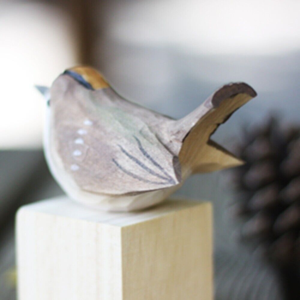Handcrafted grey bird wooden figurine, perfect decorative collectible for home or office display.