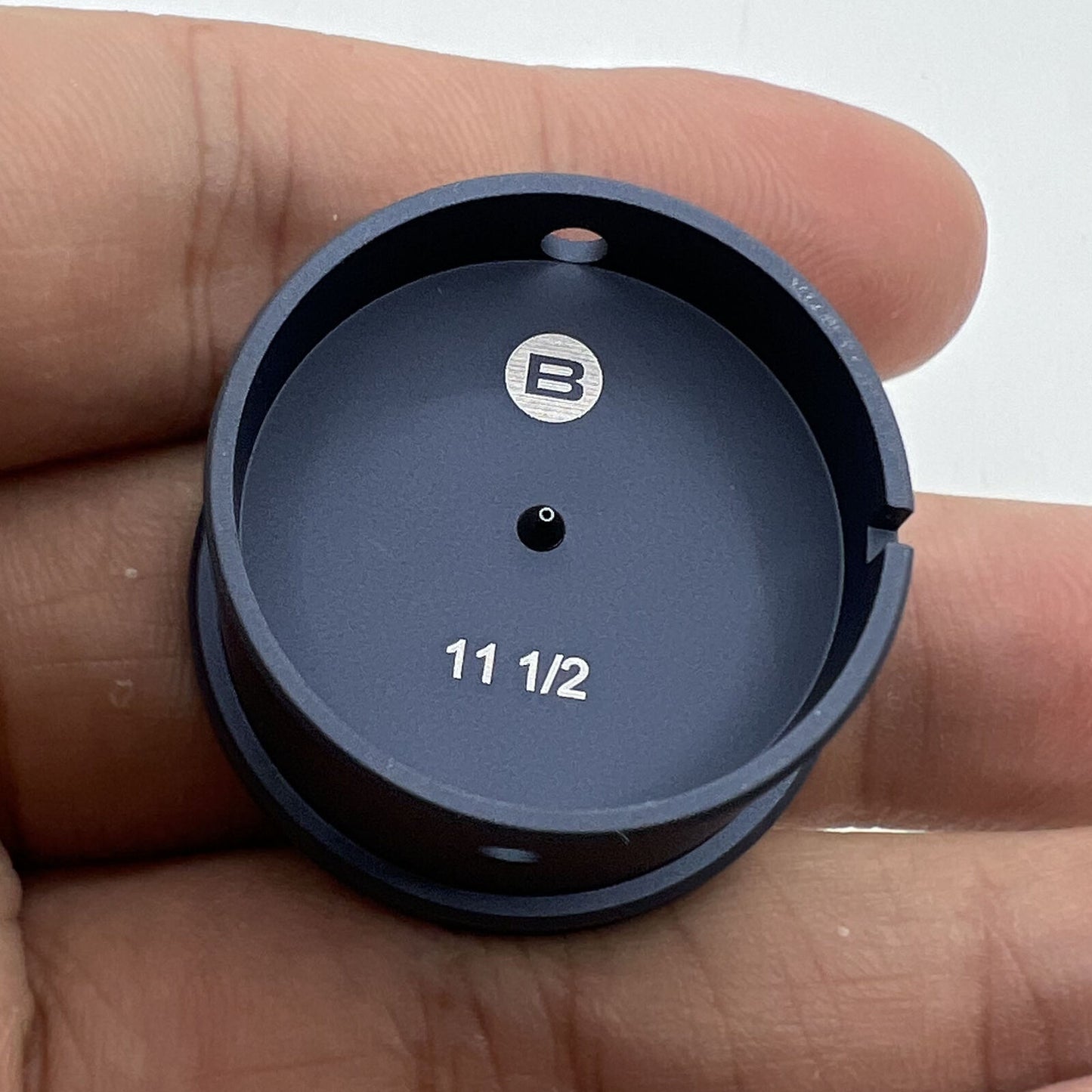 Bergeon 7100-11 1/2 watch movement holder securing Swiss watch parts for precise repairs.