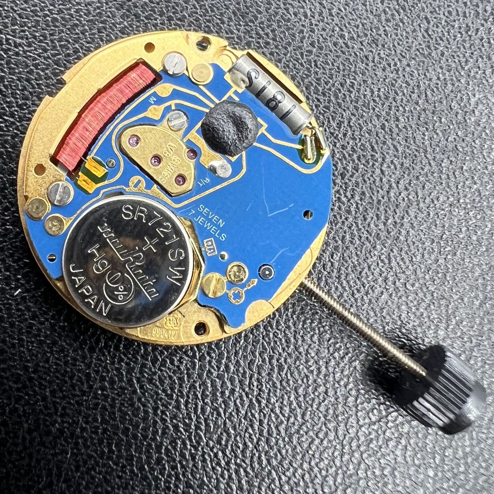 ETA 956.412 quartz watch movement showcasing 3 hands and date display at 3 o'clock for precise timekeeping.