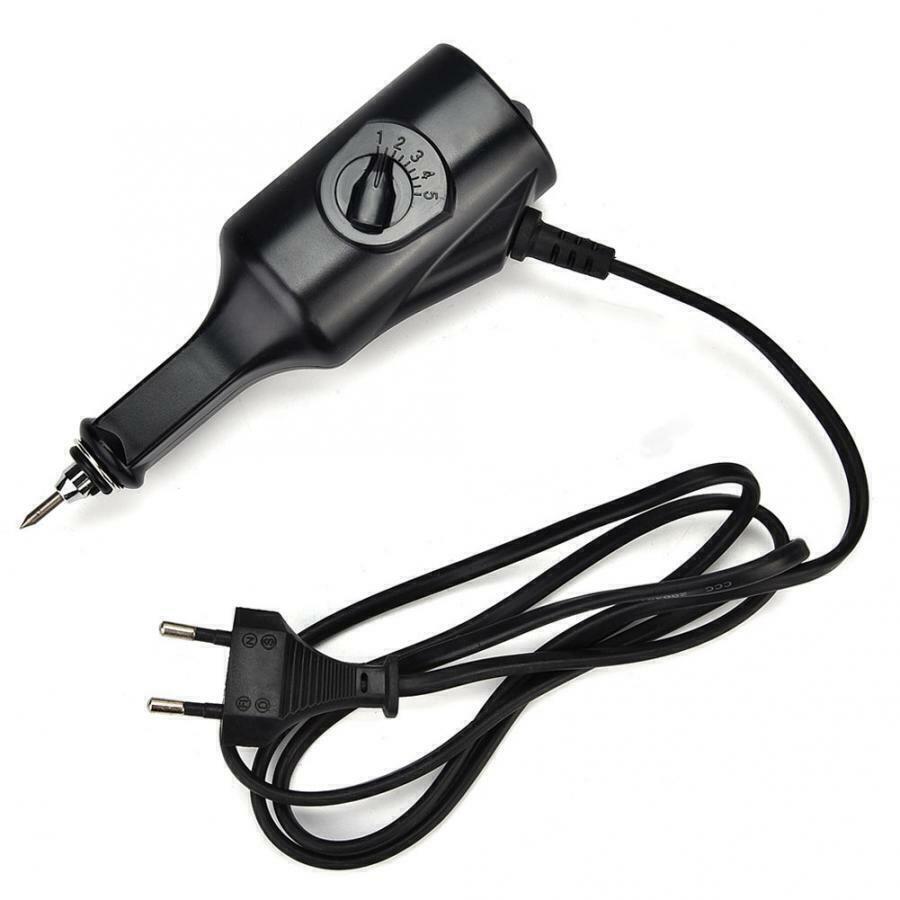 Electric jewelry engraver pen for detailed carving and precise lettering on watch accessories.