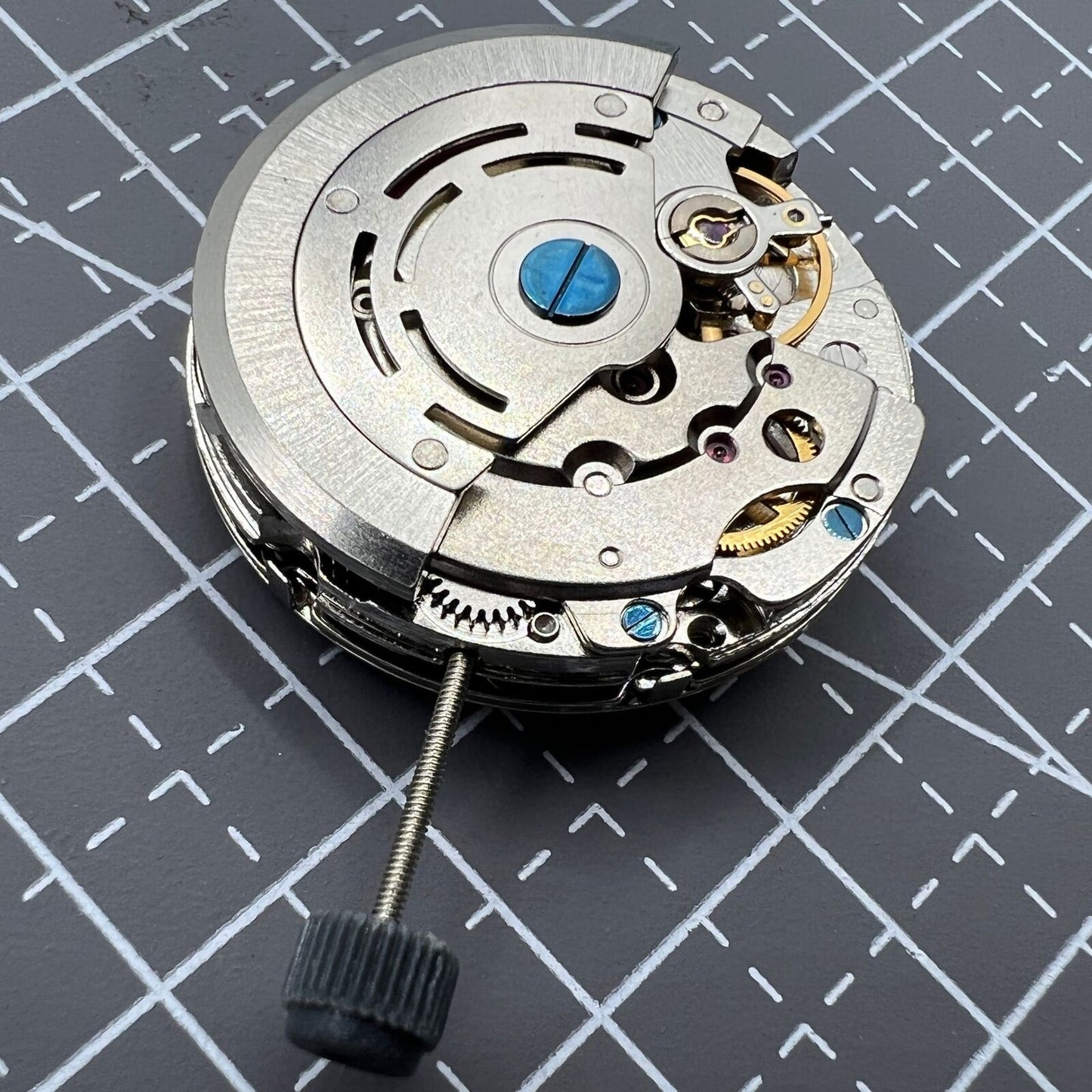 DG2813 automatic watch movement featuring three large hands and small seconds at 6 o'clock, no calendar.