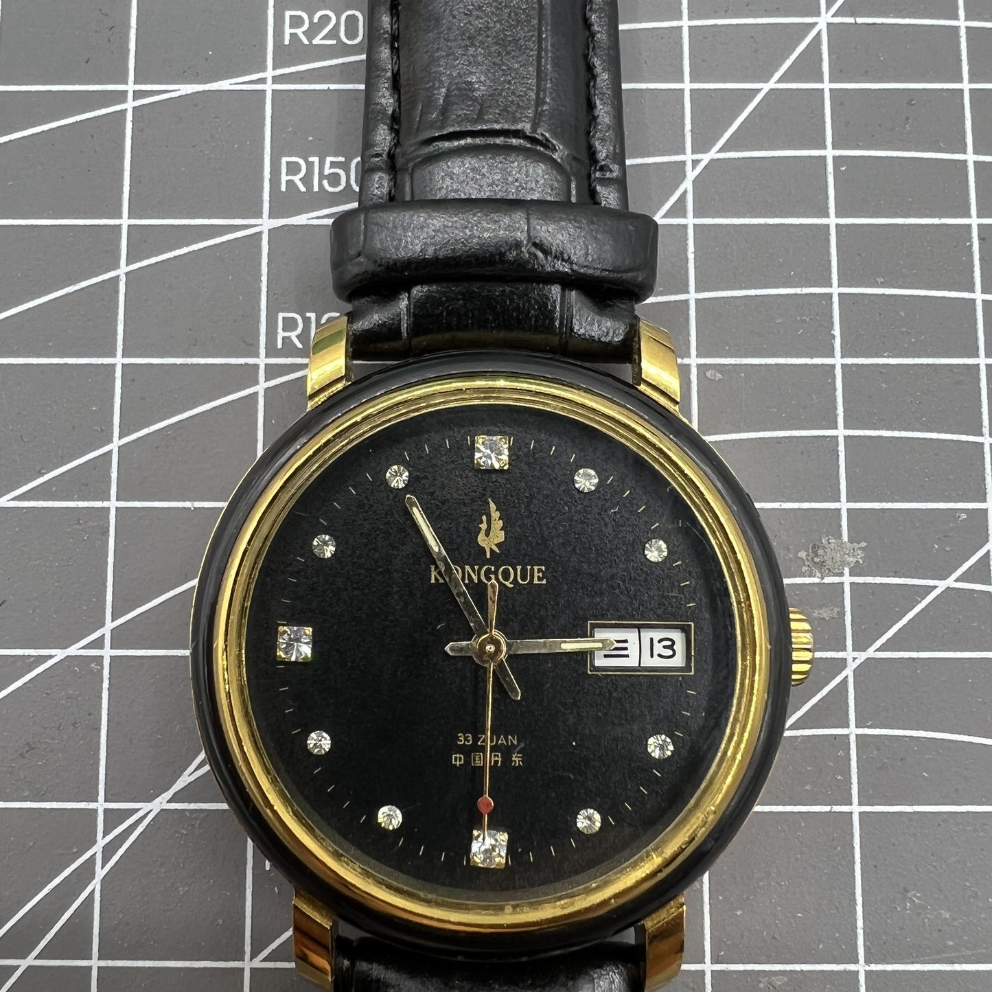 37mm Kongque automatic watch with black dial, double calendar, 33 jewels, and precise mechanical movement for stylish timekeeping.