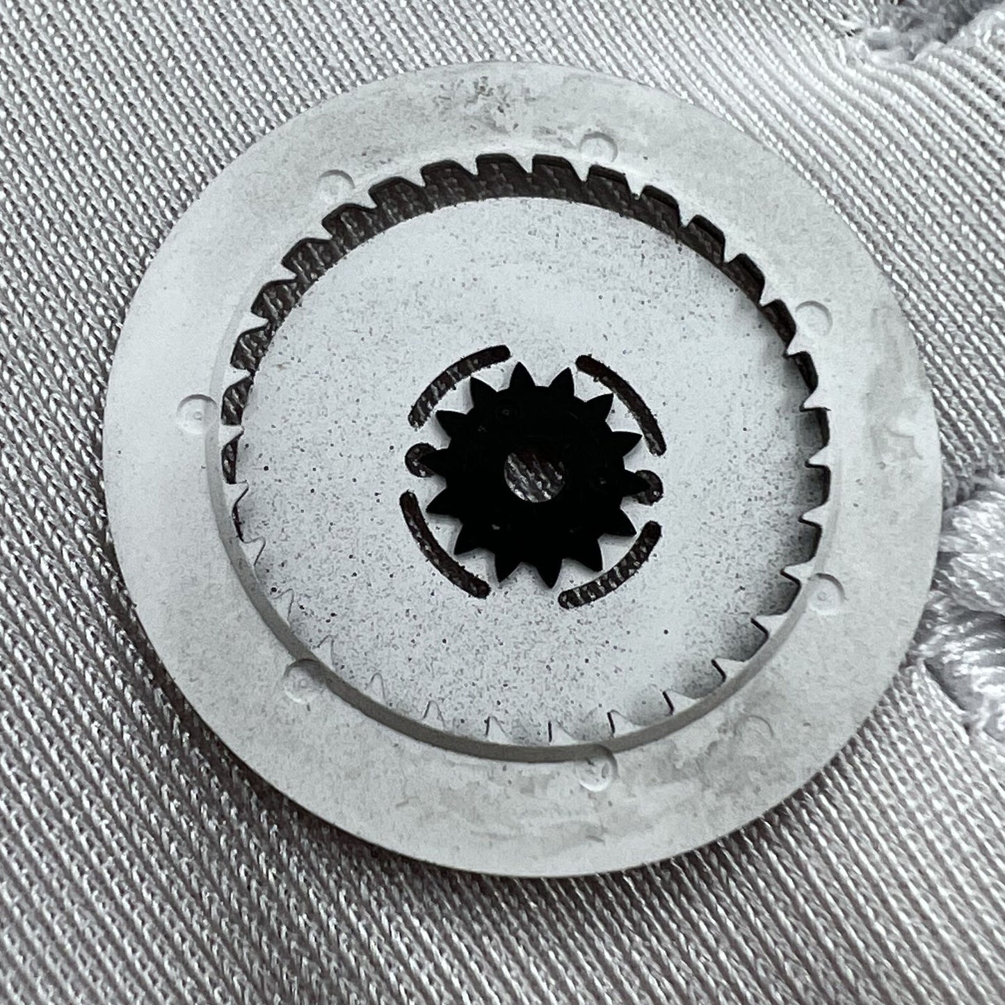 Black date disk wheel with blue and green lume accents for NH36 movement, date display at 3 o?clock.