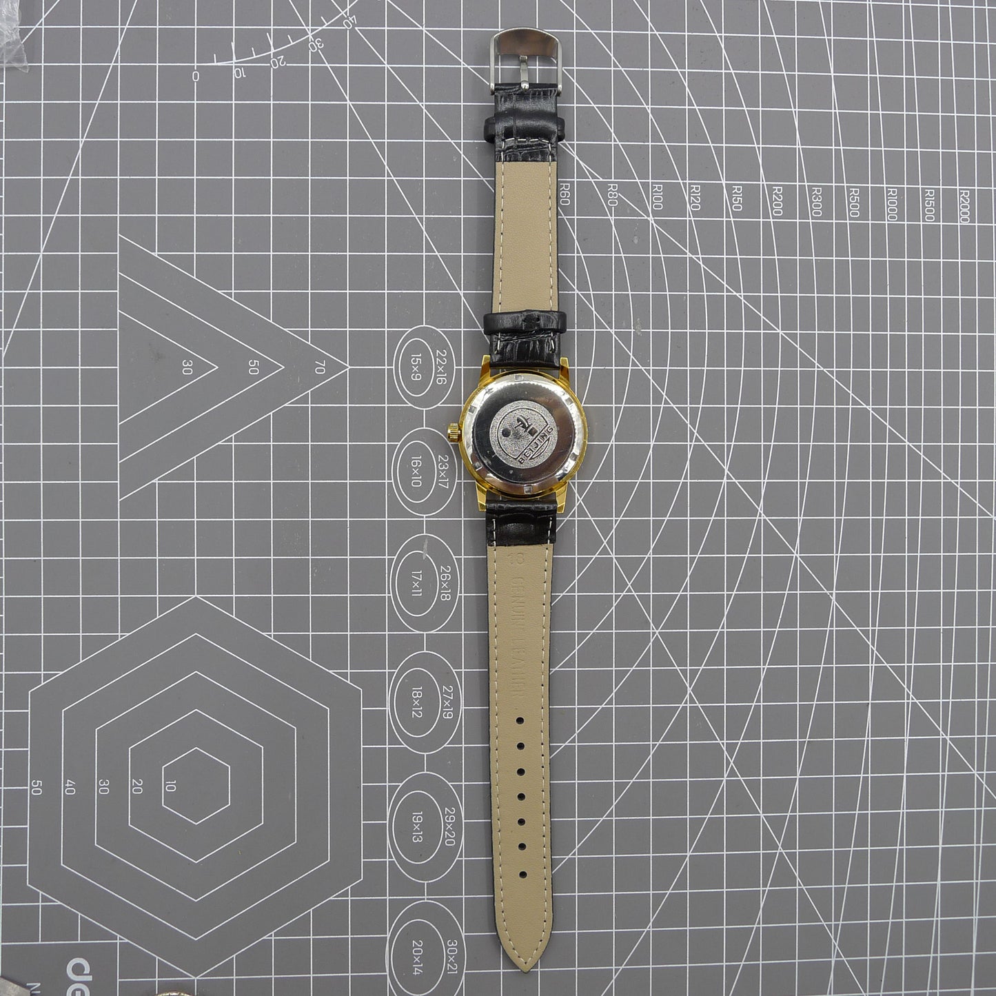 Beijing Double Rhomb mechanical watch with golden case, silver hour markers, and elegant minimalist design.
