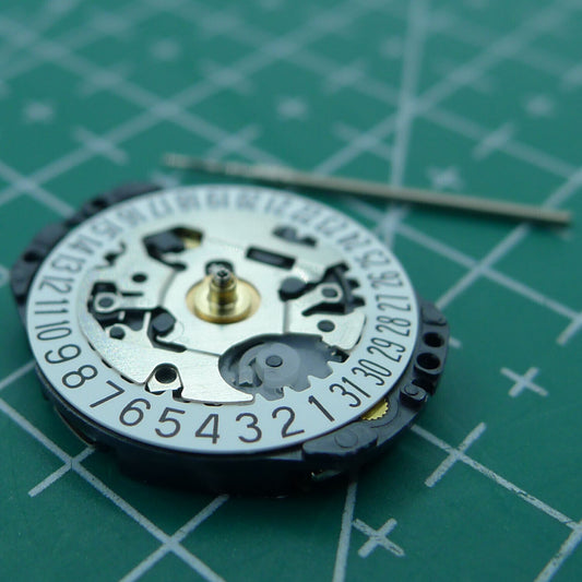 Wholesale Japan Hattori Epson TMI VX82E quartz watch movement with date display at 6 o'clock.