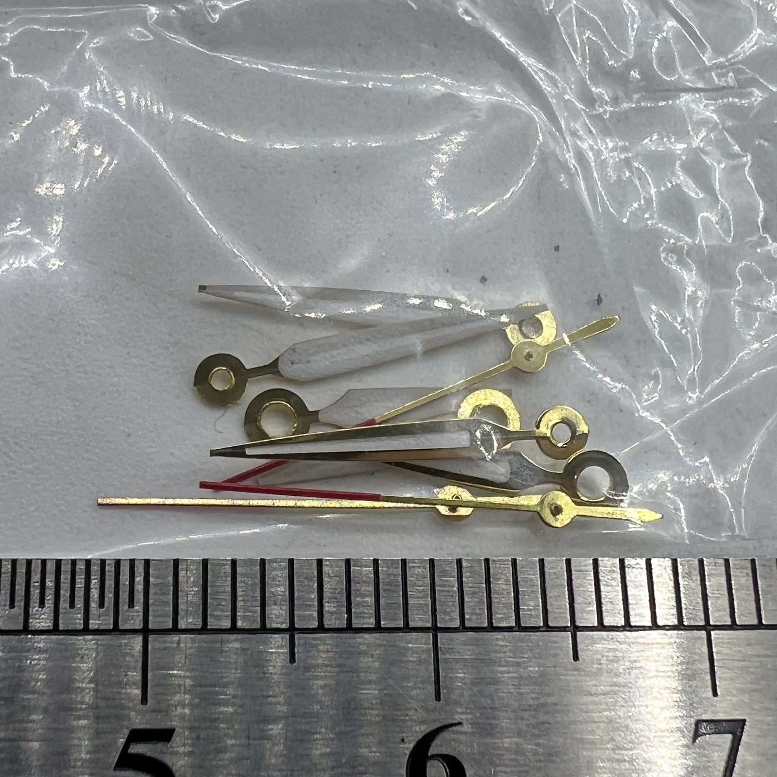 Golden-trimmed lumefor watch hands by P1-H4-C103, compatible with Miyota 2035 quartz movement, elegant detail for watch repair.