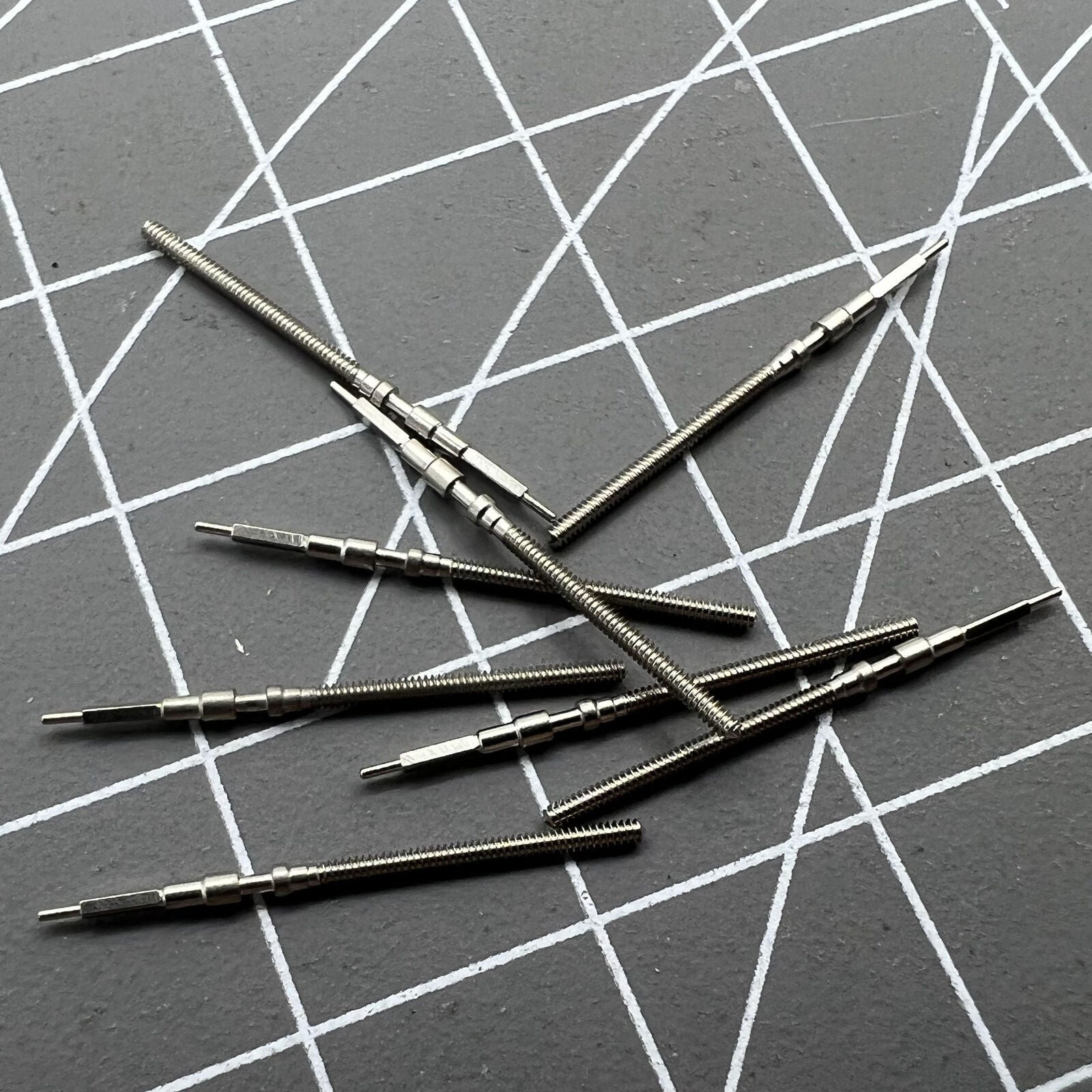 Watch winding stem for 7S26 automatic movement, precise fit for repair and maintenance.