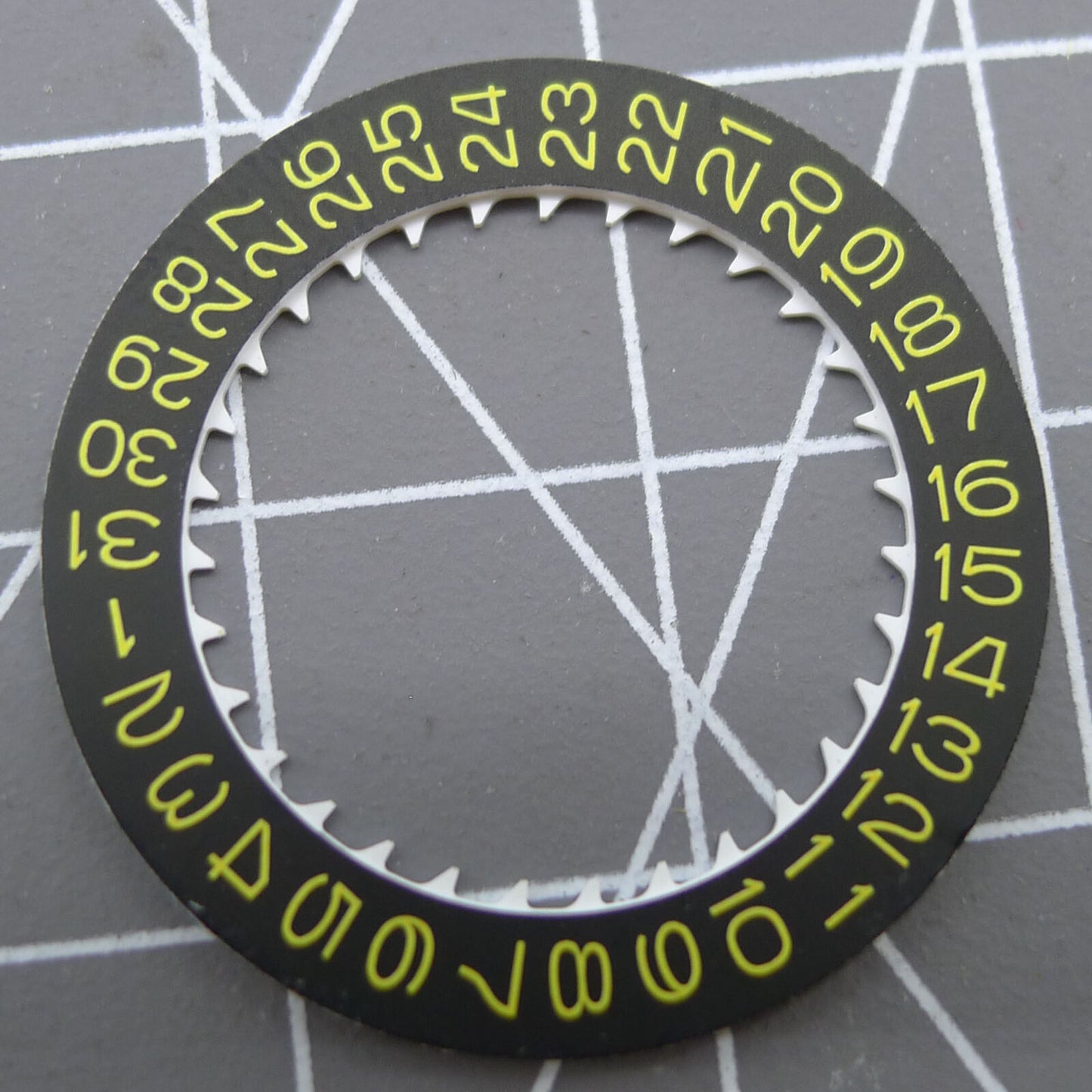 Yellow font date disk wheel on black background for NH35 watch movement, enhancing timepiece functionality.