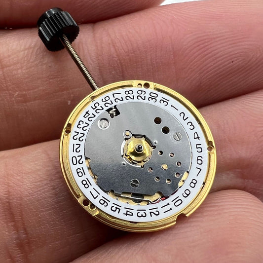 ETA F03.111 Swiss Made quartz watch movement with 3 hands and date at 3 o'clock, precision engineering.