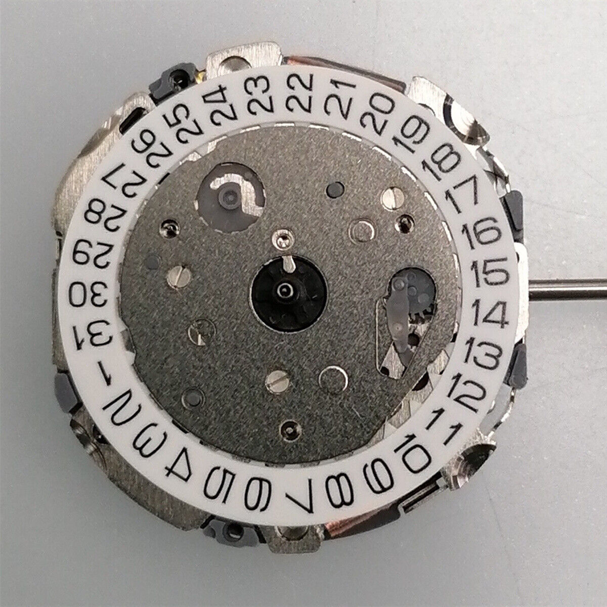 Miyota FS04 quartz movement with multifunction calendar and small seconds, precise watch mechanism.