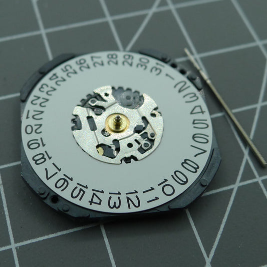 Hattori VX42E quartz watch movement showing day at 3 o'clock, made in Japan for precise timekeeping