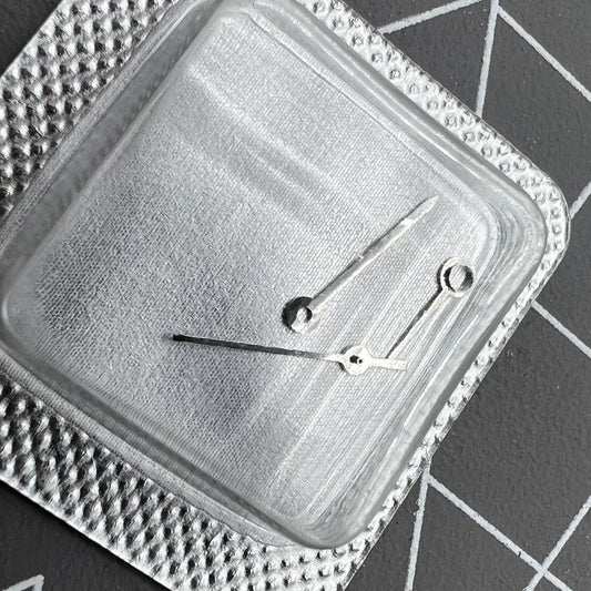 Silver watch hands set for ETA 956.112 movement, including hour, minute, and second hands.