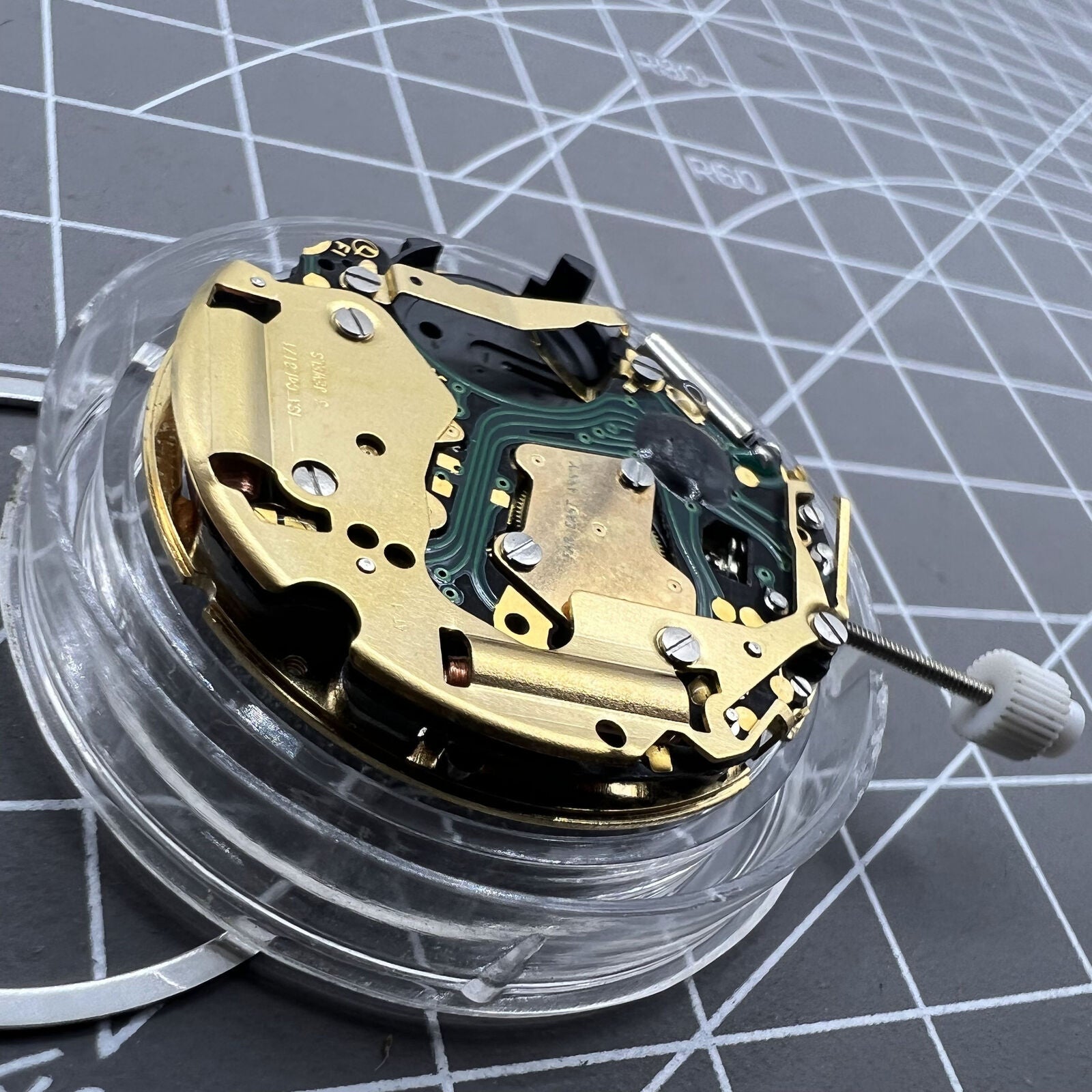 ISA 8171 Swiss quartz watch movement with date at 4, 6 hands on white dial by ISA.