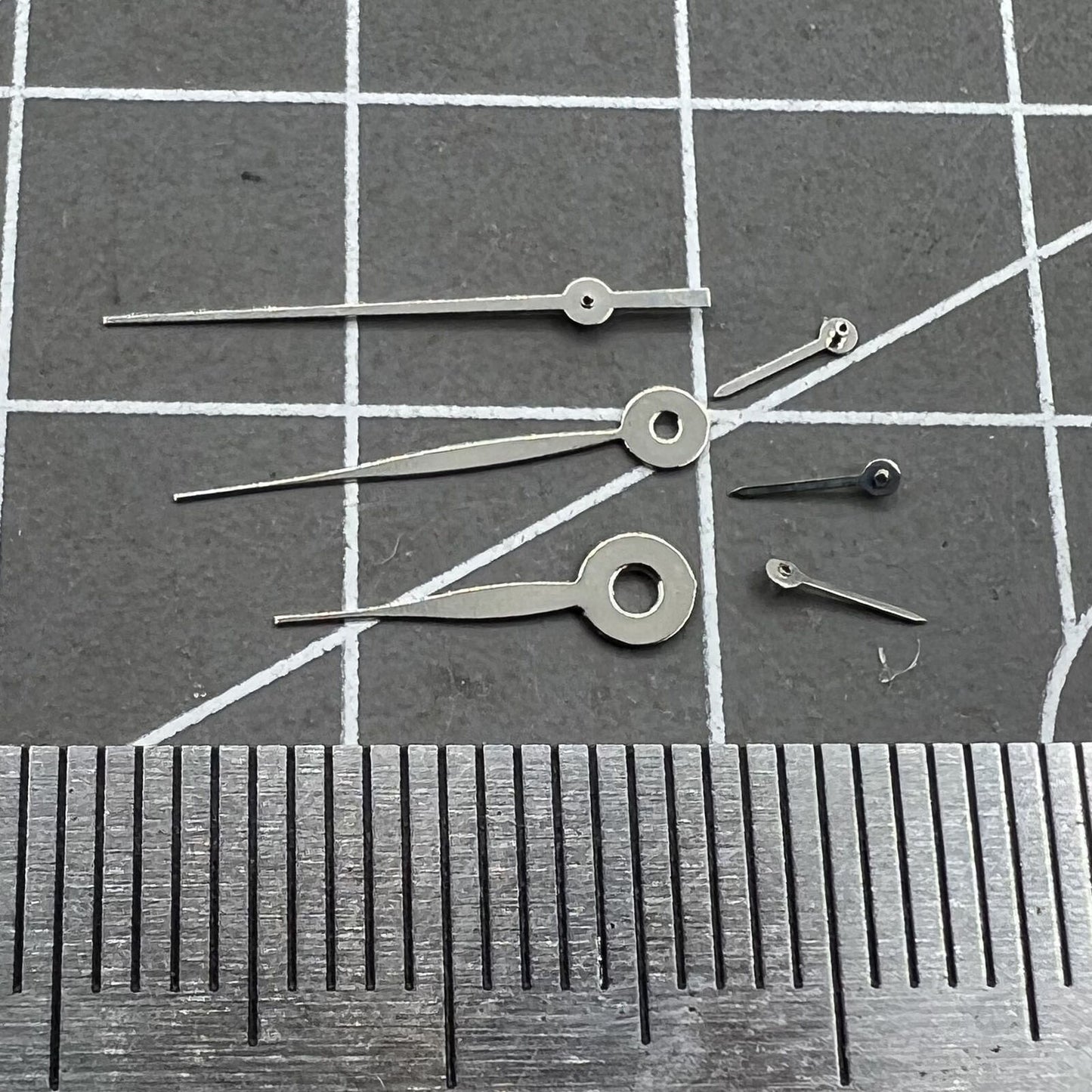 14mm silver long arrow watch hands for Miyota 0S11 movement, no lume, sleek design.