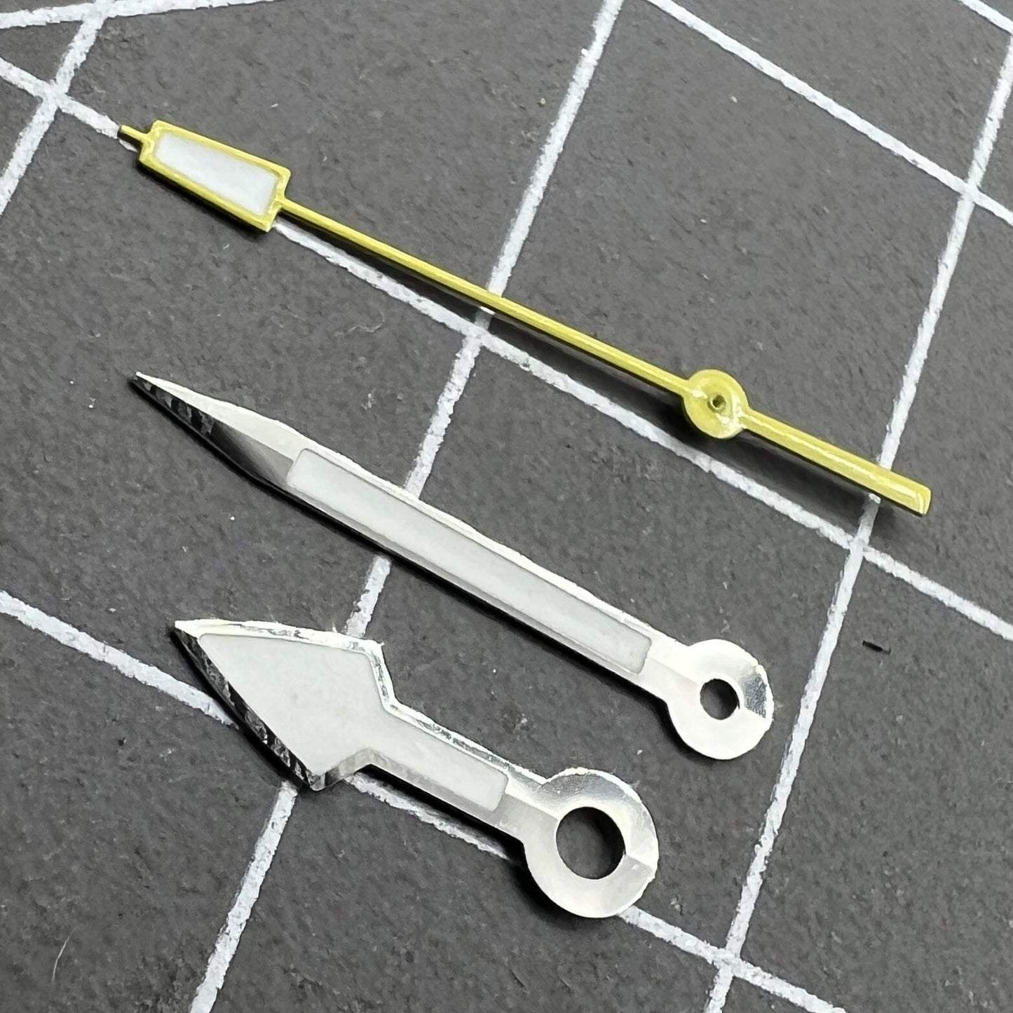 Arrow-shaped silver watch hands with yellow second hand and green lume, fitting NH35 NH36 movements.