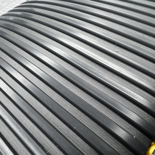 Swiss Bergeon grooved bench mat for watch repair, self-adhesive and durable work surface.