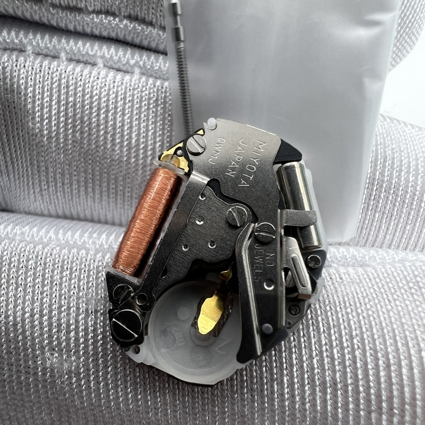 Japan Made Miyota 2035 quartz watch movement with 3 hands and stem for accurate timekeeping.