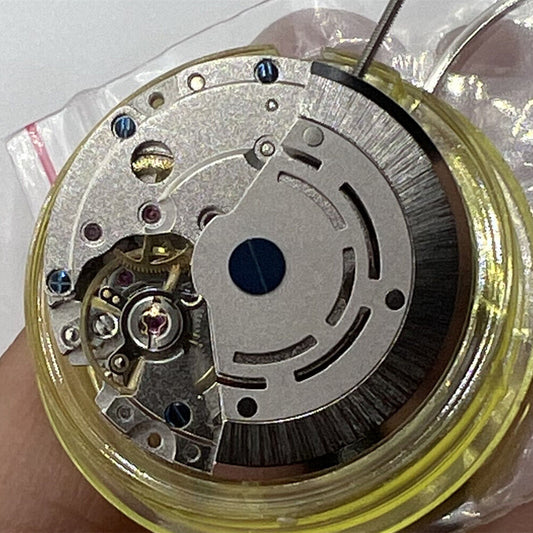 DG2813 Automatic watch movement with 4 hands and adjustable 24-hour GMT function in silver finish.