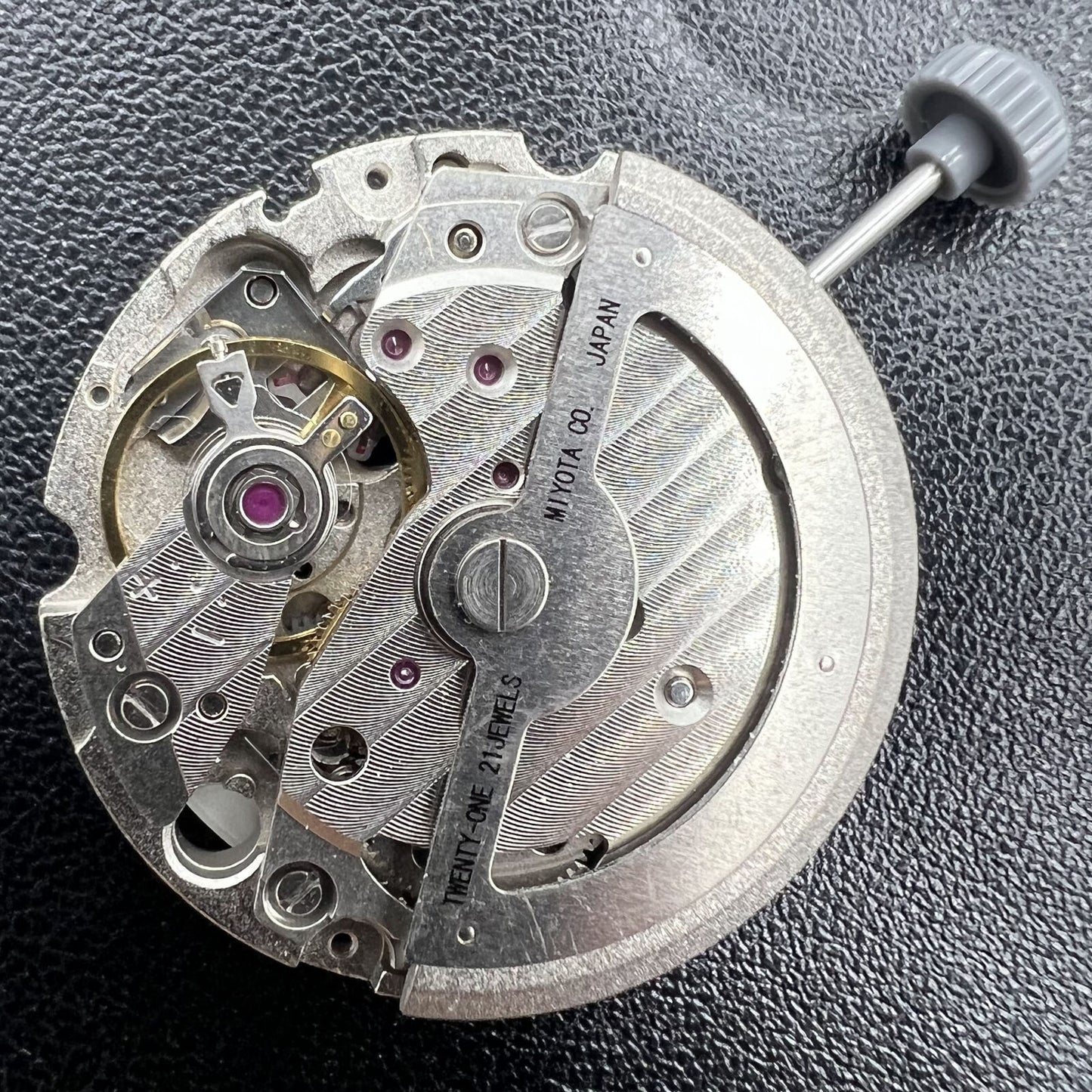 Miyota 8217 automatic watch movement displaying three hands with a small seconds subdial at 9 o'clock.
