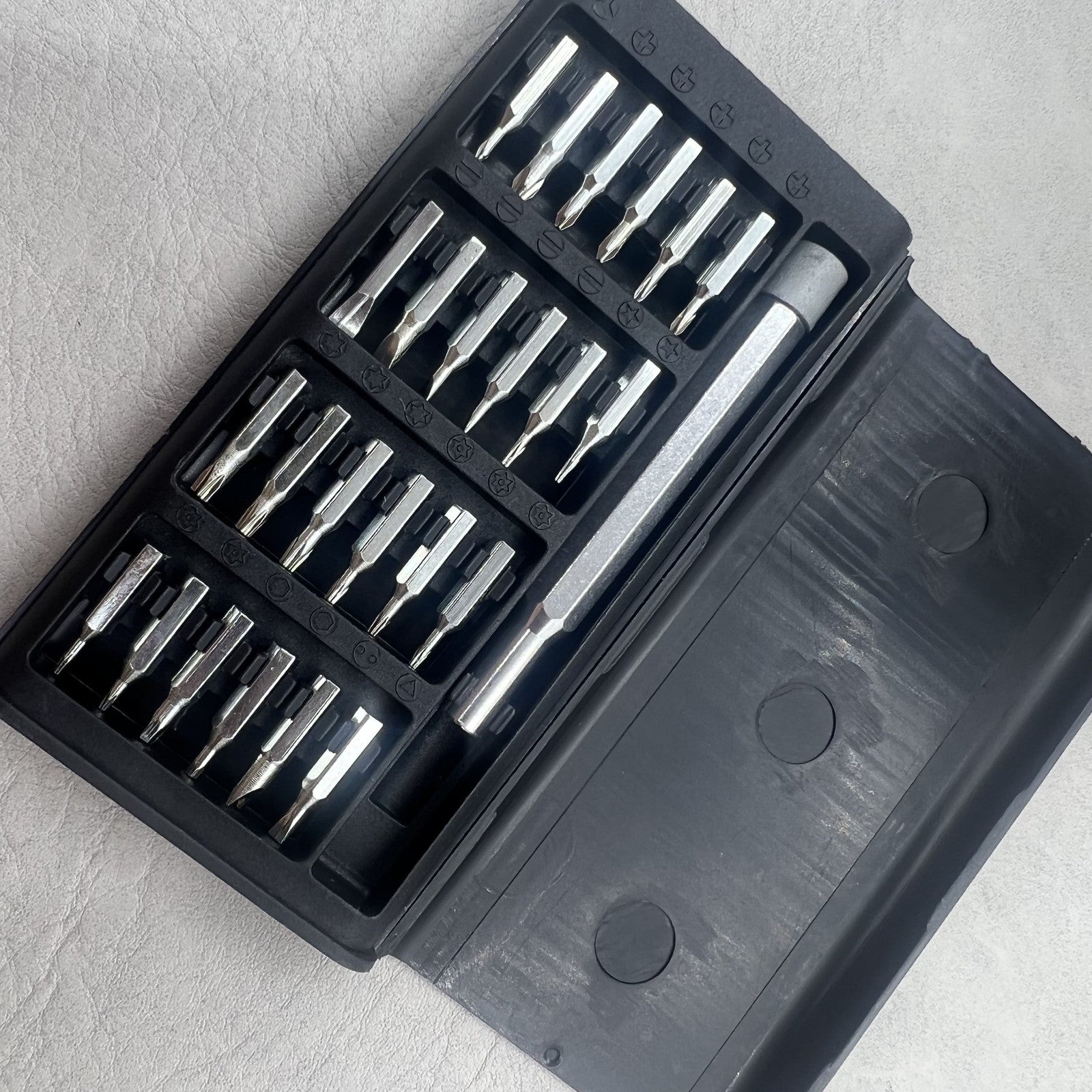 24-in-1 precision multi-tool set with magnetic alloy screwdrivers for watch repairs, branded quality.