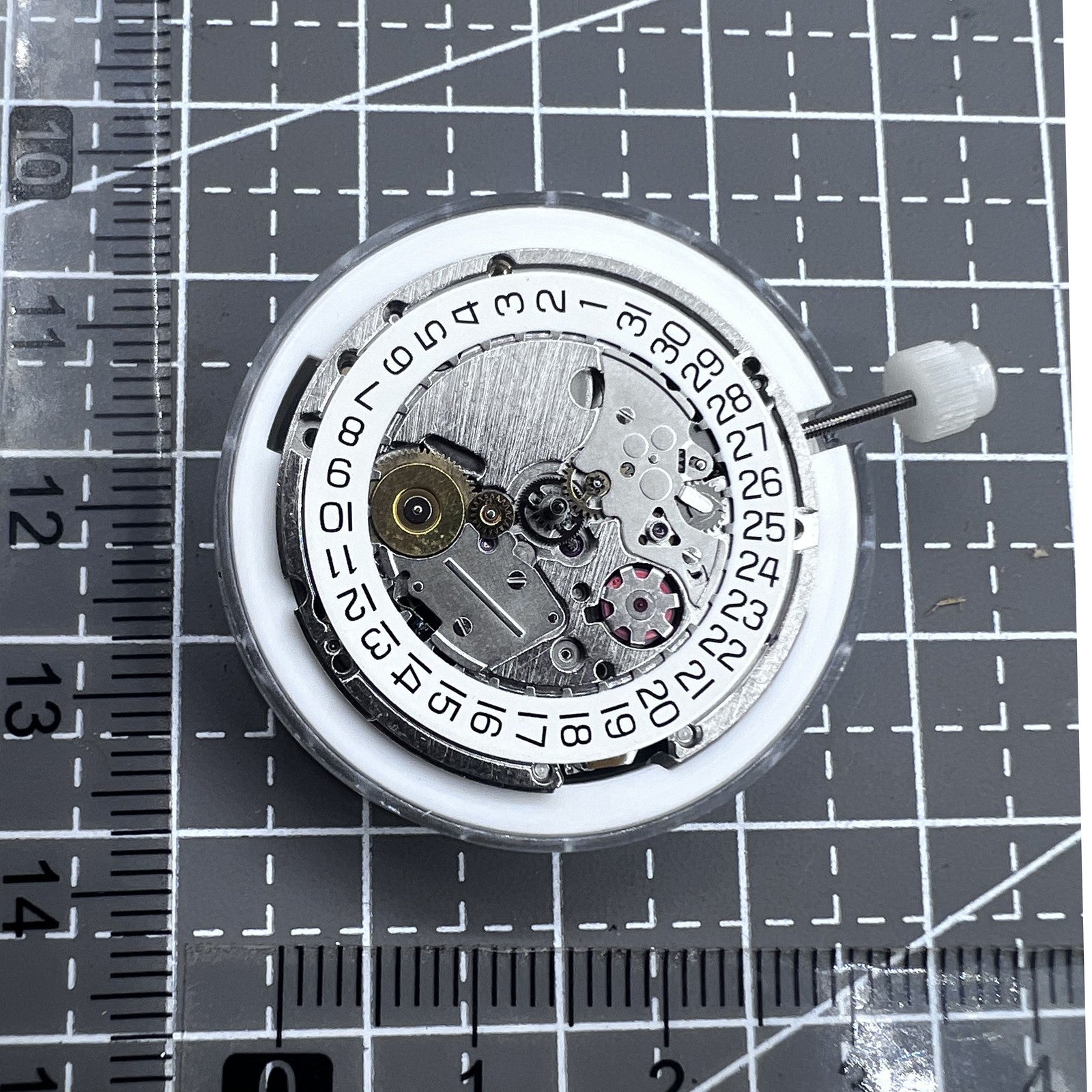 Swiss Silver ETA 205.111 kinetic watch movement by ETA, precise mechanism for expert watch repair.