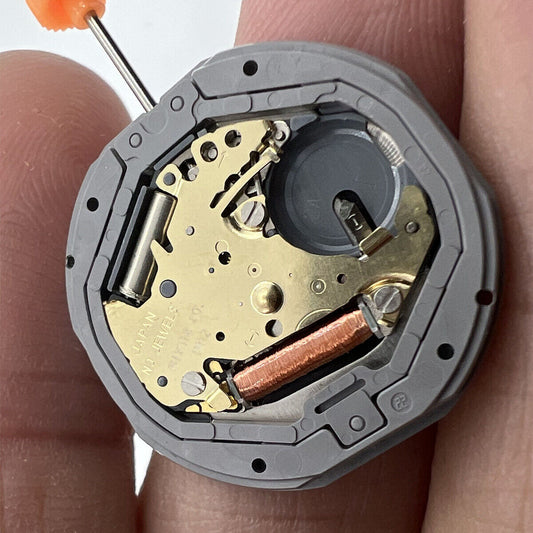 Black dial watch with Miyota 1M12 quartz movement, 3 hands, date at 6, and classic stem design.