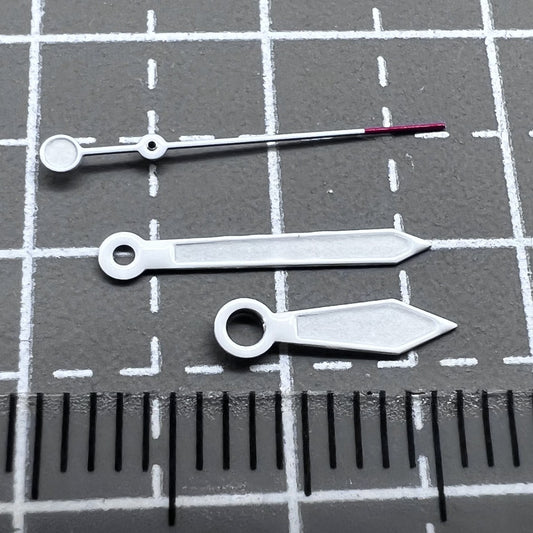Green lume arrow-shaped watch hands with white trim and red pointed tips, compatible with NH35 NH36 movements.