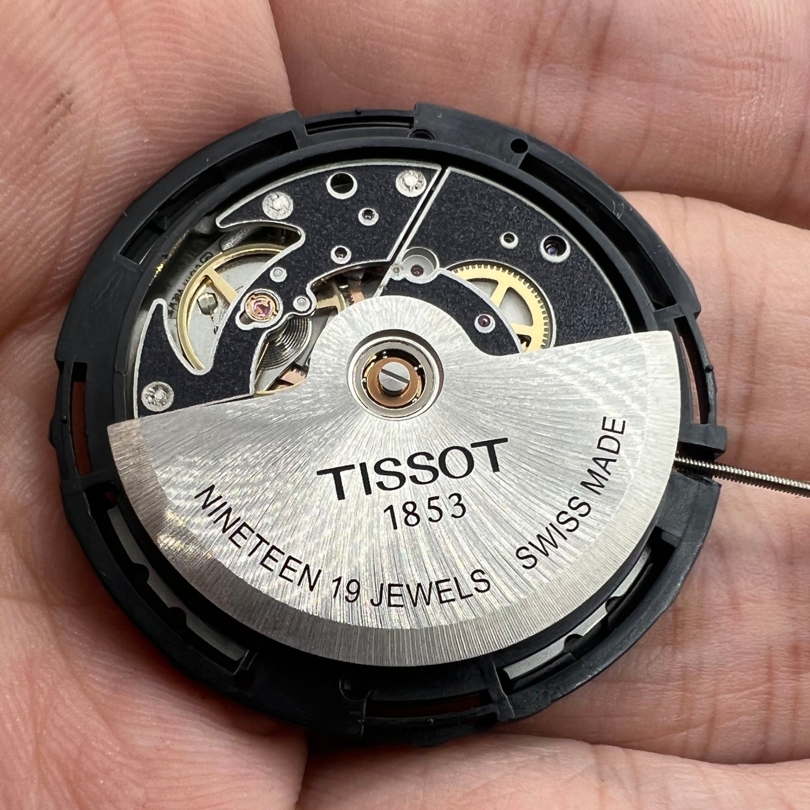 ETA C15.111 chronograph watch movement by Tissot 1853, white dial with Swiss precision craftsmanship.